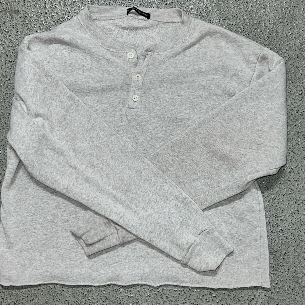 White long sleeve Brandy Melville shirt.
